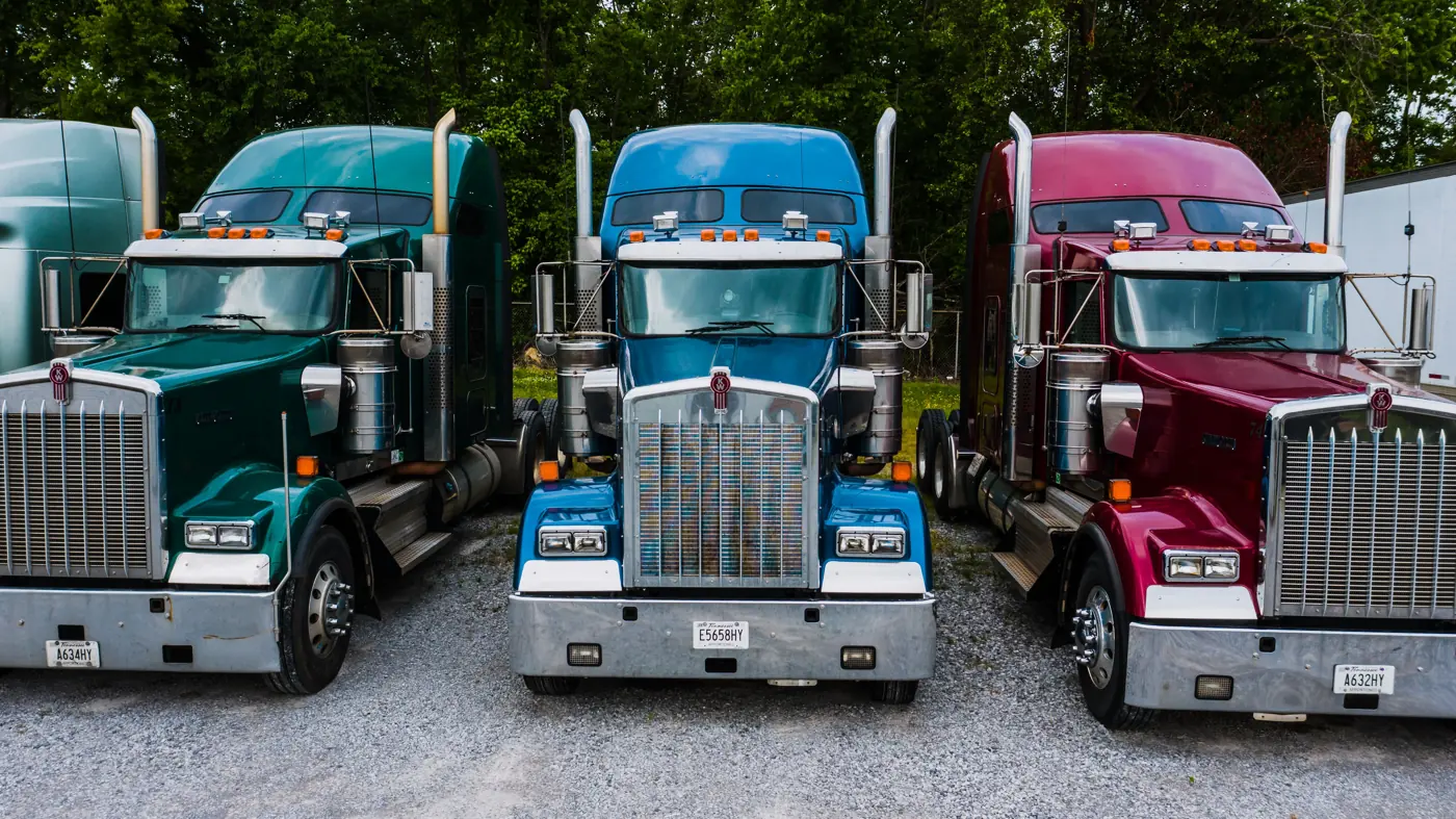 Small fleet of trucks parked